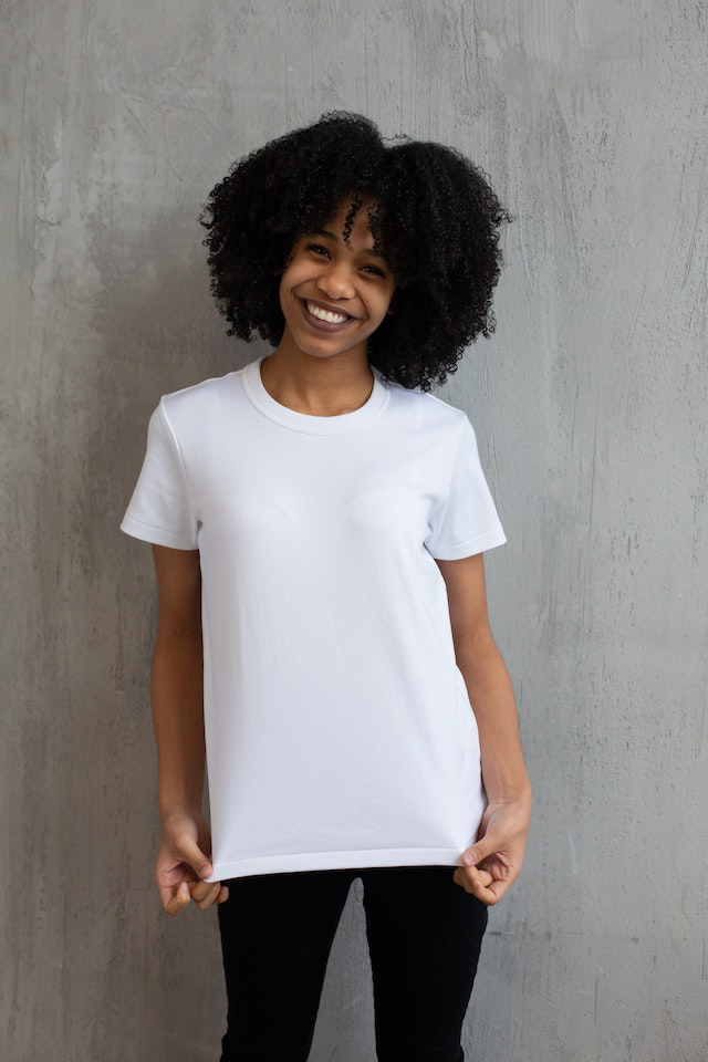 A women standing with white t shirt
